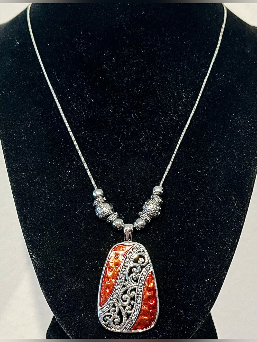 Silver-Tone Necklace with Orange Resin and Scrollwork Pendant